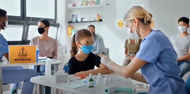 Health care workers giving the COVID-19 vaccine