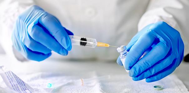 Stock image of researcher preparing vaccination