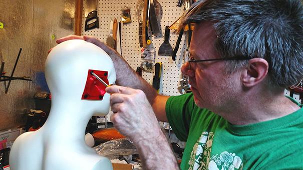 Don Finan attached 3d ear to mannequin